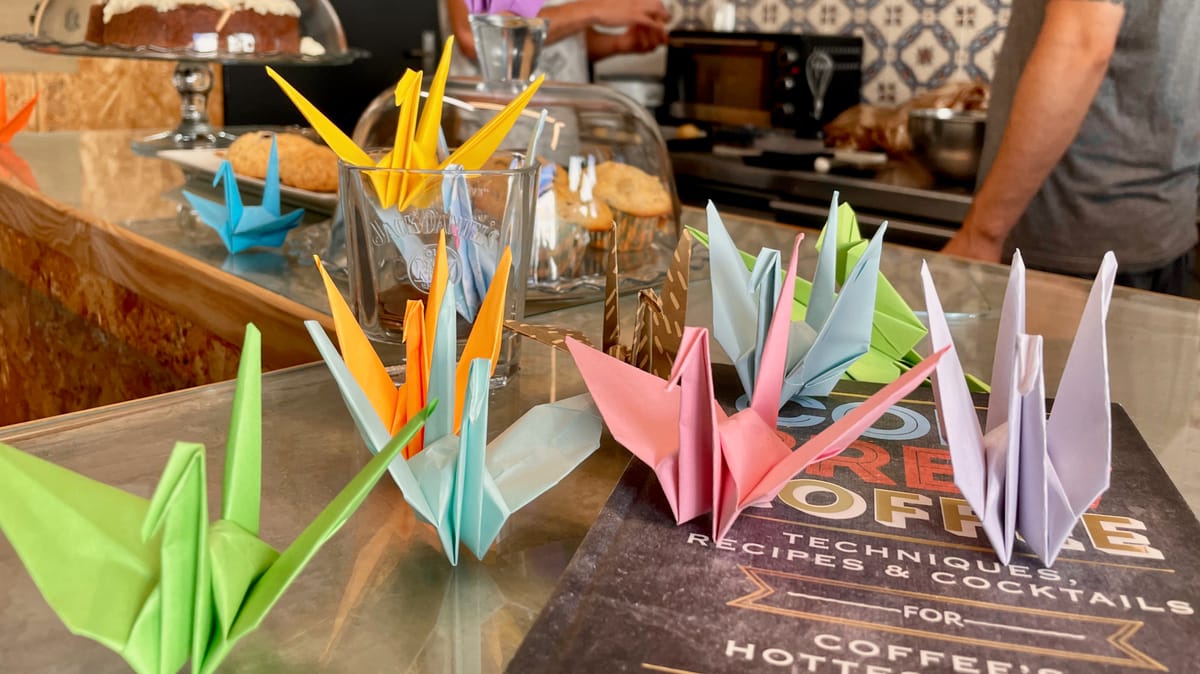 Paper cranes and coffee cups