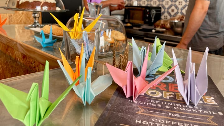 Paper cranes and coffee cups