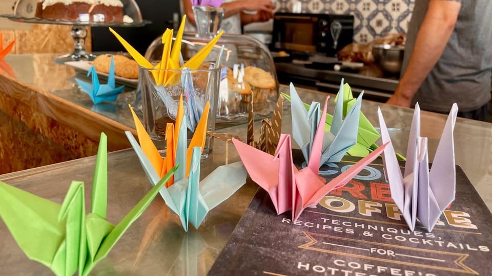 Paper cranes and coffee cups
