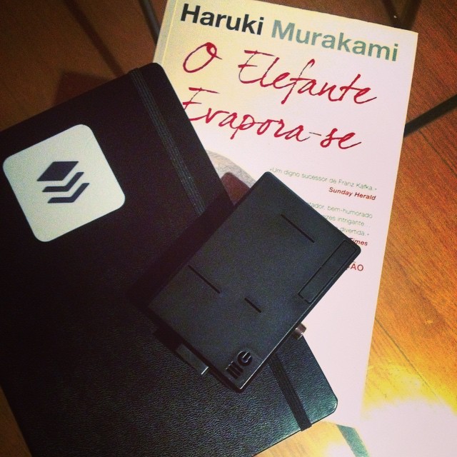 Books, notebooks, and a little Black box.
